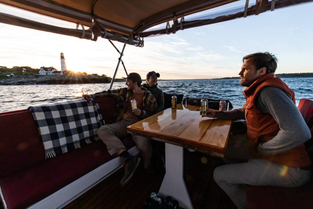 Sunset Cruise by Portland Head Light. Photo Credit: Casco Bay Custom Charters