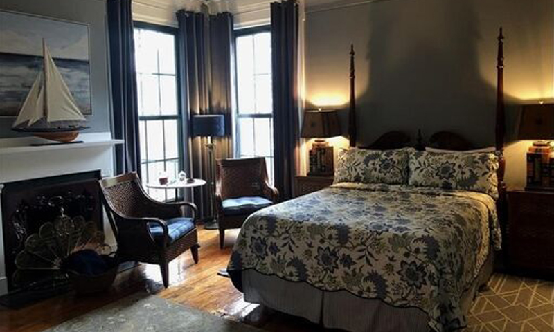 King Bedroom with Sailboat Painting, Photo Courtesy of Percy Inn - listing