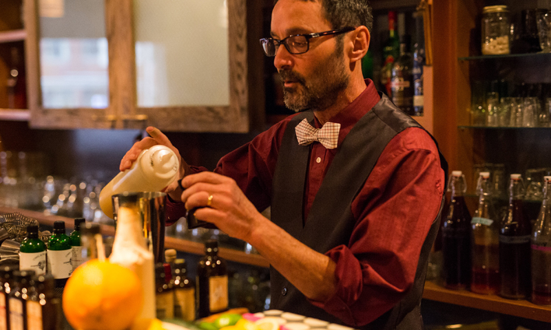Bartender mixing drink courtesy of Vena's Fizz House
