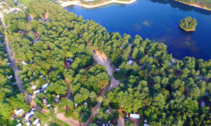 Aerial view of campground's private beach and surrounding park. Image Courtesy of Wassamki Springs Campground