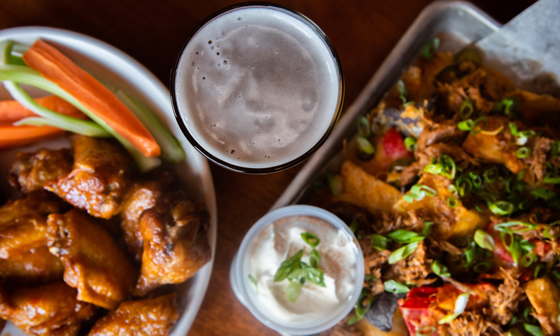Wings and Nachos. Photo Credit: $3 Deweys