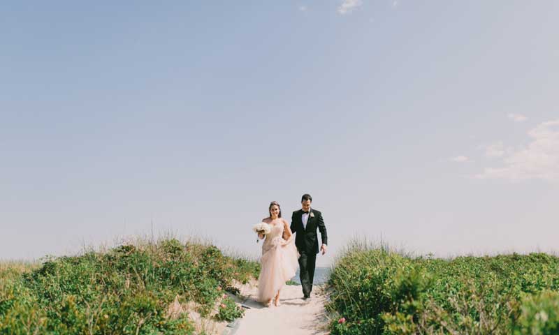 Wedding Couple on Beach Path. Photo Provided by Inn by the Sea
