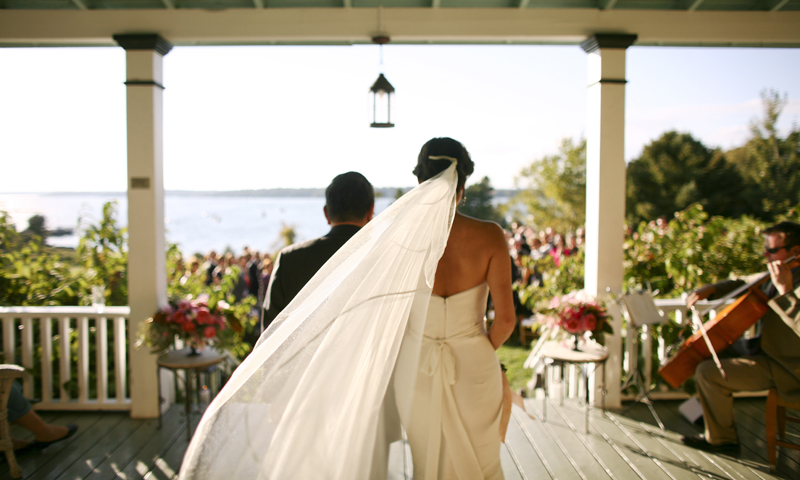 Wedding couple on porch. Photo Provided by Chebeague Island Inn