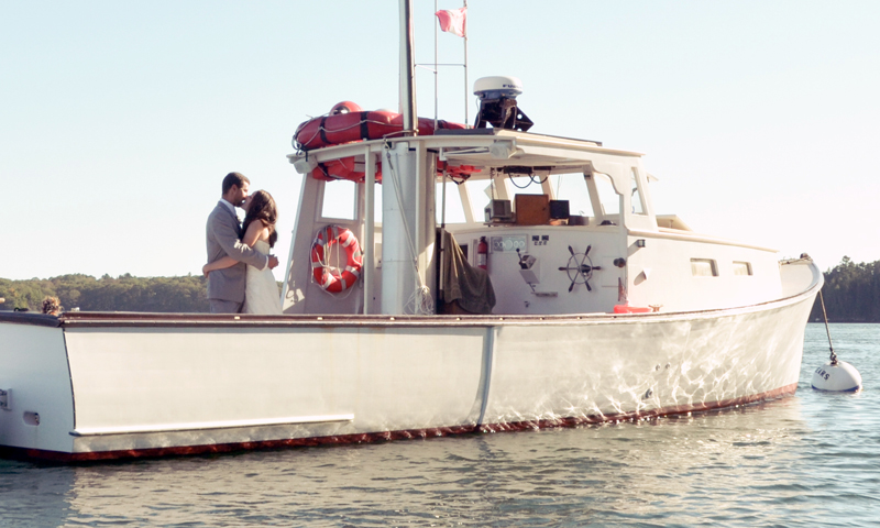 Wedding couple on boat. Photo Provided by Casco Bay Custom Charters