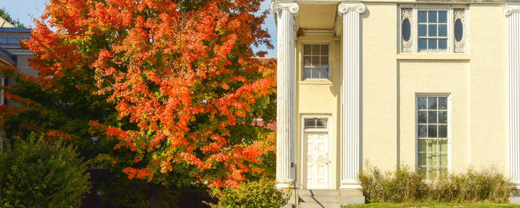 Historic Site in Portland, Photo Credit: Corey Templeton historic site in downtown portland white building next to bright orange tree