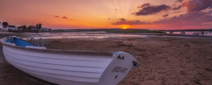 Pine Point Sunrise With Boat on Shore, Photo Credit: CFW Photography