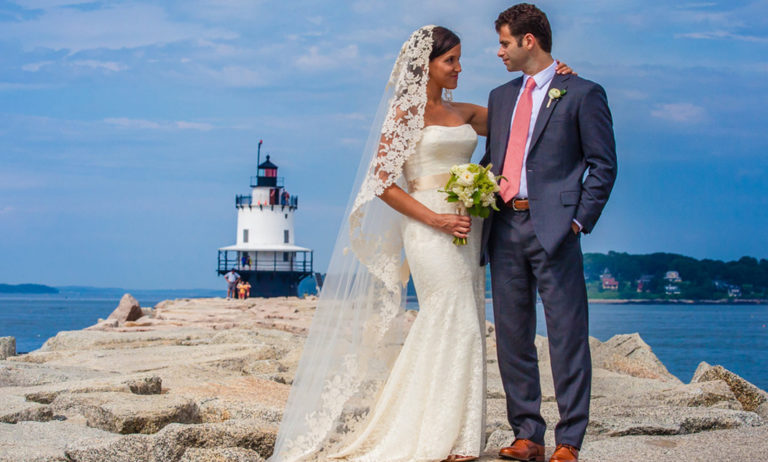 Bride and Groom Posing in Front of Lighthouse, Photo Credit: Luxury Hero Bride and Groom Posing in Front of Lighthouse, Photo Credit: Luxury Hero