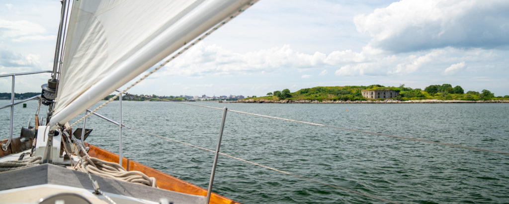 Sailboat Glimpsing Fort Gorges Military Fort, Photo Courtesy of Kirsten Alana / GLP Films Schooner Passing Near Fort Gorges, Photo Courtesy of GLP Films