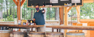 Server in Mask in Tasting Room, Photo Courtesy of Mat Trogner, via Allagash Brewing