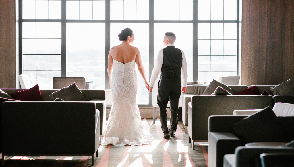 Couple Looking out Window at Wedding, Photo Credit: Jessie Felix Photography via The Westin