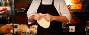 Chef Tossing Pizza Dough at Freeport Restaurant, Photo Courtesy of Visit Freeport
