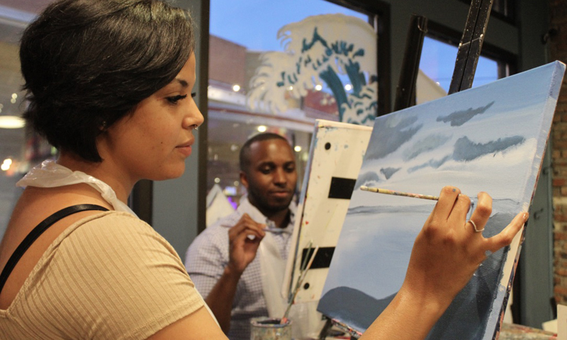 Couple Painting at Muse Paintbar, Photo Courtesy of Muse Paintbar Couple Painting at Muse Paintbar, Photo Courtesy of Muse Paintbar