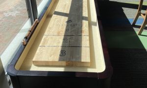 Shuffleboard at X-Golf Portland. Photo Credit: Lauren Whitney