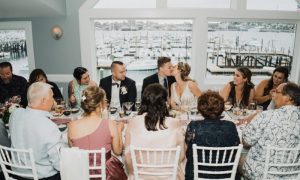 Wedding Party at Dinner table. Photo Credit: The Camerados