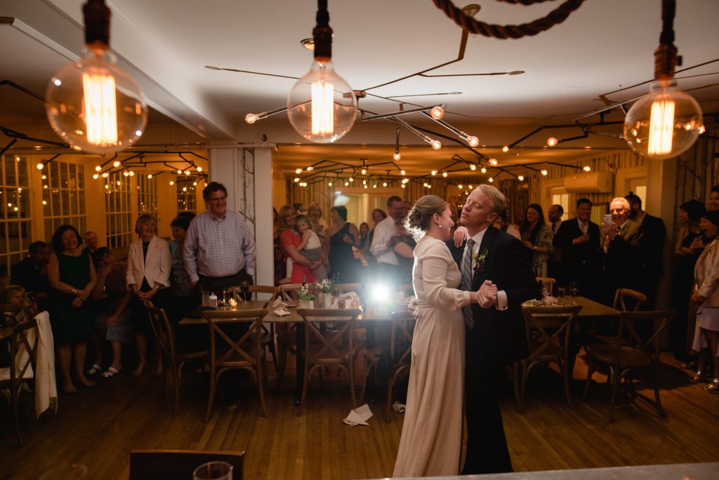 A bride and groom dancing in the main dining room. Photo Credit: Novella Photography