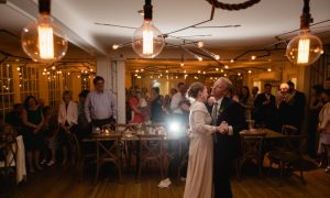 A bride and groom dancing in the main dining room. Photo Credit: Novella Photography