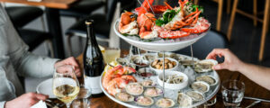 Dining at Helm. Photo Credit: Erin Little Photography