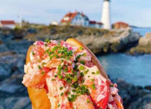 Lobster roll by Portland Head Light, Photo Courtesy of Bite Into Maine