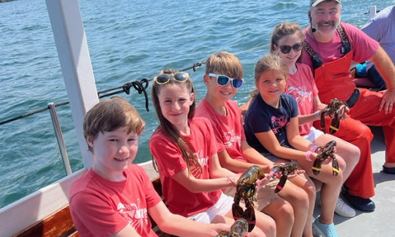 Kids with Lobsters and Mark. Photo Provided by Rugosa Lobster Tours