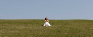 Woman in field header. Photo Courtesy of @MarriottBonvoy