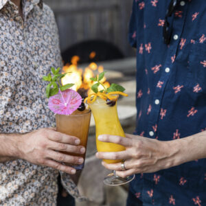 Mixed drinks in front of a fire, Photo Credit: Justin Smulsk