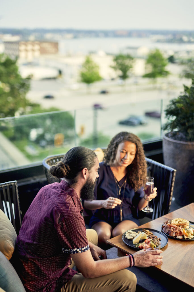 Couple at Luna Rooftop Bar. Photo Credit: Lone Spruce Creative, courtesy of Maine Office of Tourism Couple at Luna Rooftop Bar. Photo Credit: Lone Spruce Creative, courtesy of Maine Office of Tourism