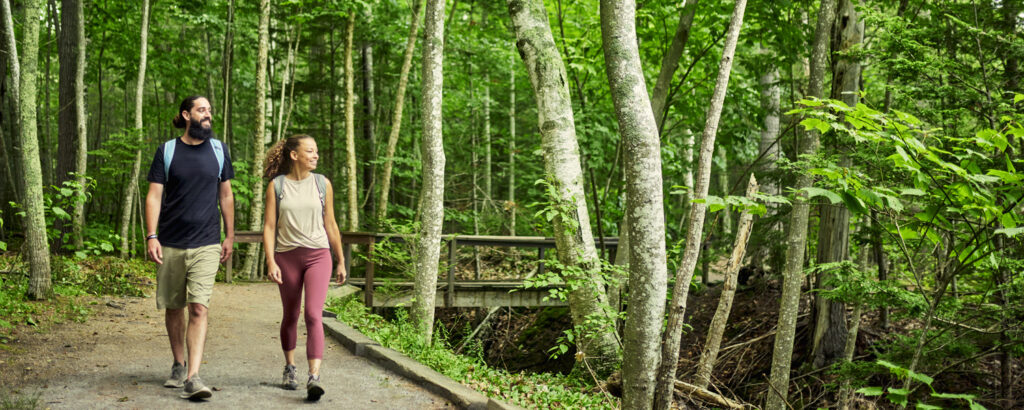 Couple walking on trail, Photo credit: Lone Spruce Creative, courtesy of Maine Office of Tourism Couple walking on trail, Photo credit: Lone Spruce Creative, courtesy of Maine Office of Tourism
