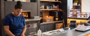 Making food at Canopy cafe, Photo Credit: Lauren Peters at Visit Portland