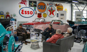 People sitting at Maine Classic Car Museum, Photo Credit: Lauren Peters at Visit Portland