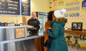 Socializing in donut store; Photo Credit: Lauren Peters at Visit Portland