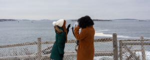 Women looking out to sea; Photo Credit: Lauren Peters at Visit Portland