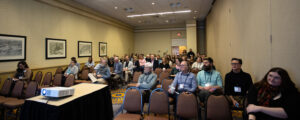 Attendees Listening to Presentation. Photo Credit: Focus Photography