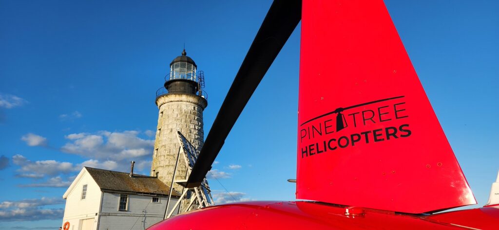 Helicopter at Lighthouse. Photo Credit: Pine Tree Helicopters