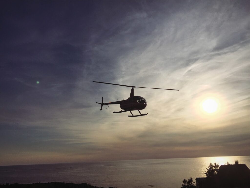 Helicopter flying. Photo Credit: Pine Tree Helicopters