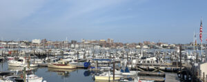 Boat marina with Portland city skyline; Photo Credit: Lauren Peters at Visit Portland
