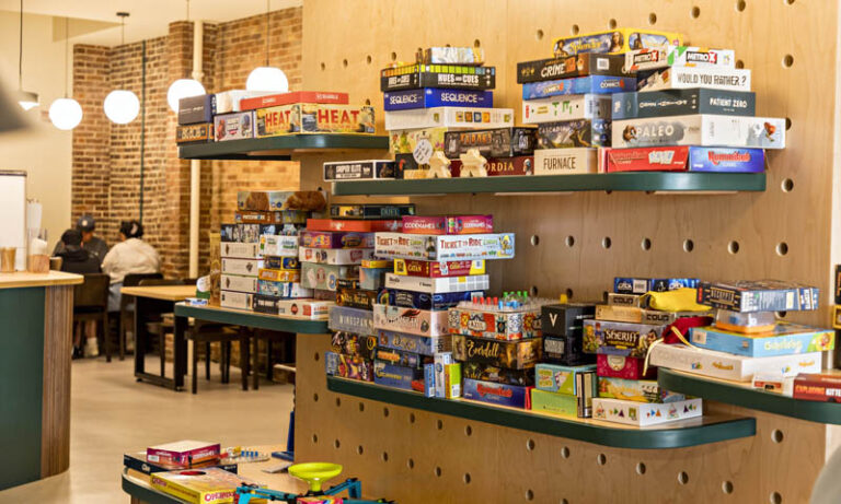 Wall of games at Another Round; Photo Credit: Amanda Huebner Photography
