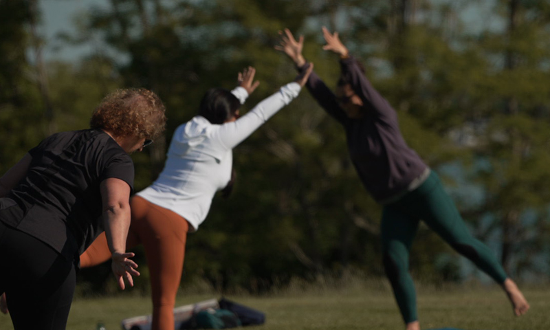 Doing yoga in a park; Photo Credit: Digital Edge Doing yoga in a park; Photo Credit: Digital Edge