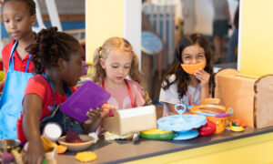 Kids playing with interactive grocery store; Photo Credit: Hannah Ellsworth