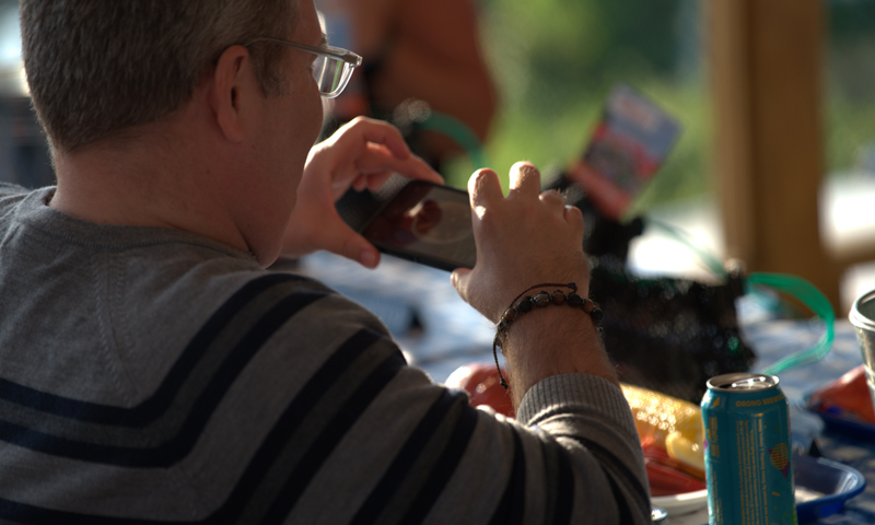 Man taking picture of Maine lobster dinner; Photo Credit: Digital Edge Man taking picture of Maine lobster dinner; Photo Credit: Digital Edge