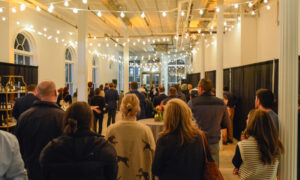Group listening to a speaker present; Photo Credit: Lauren Witt at Visit Portland