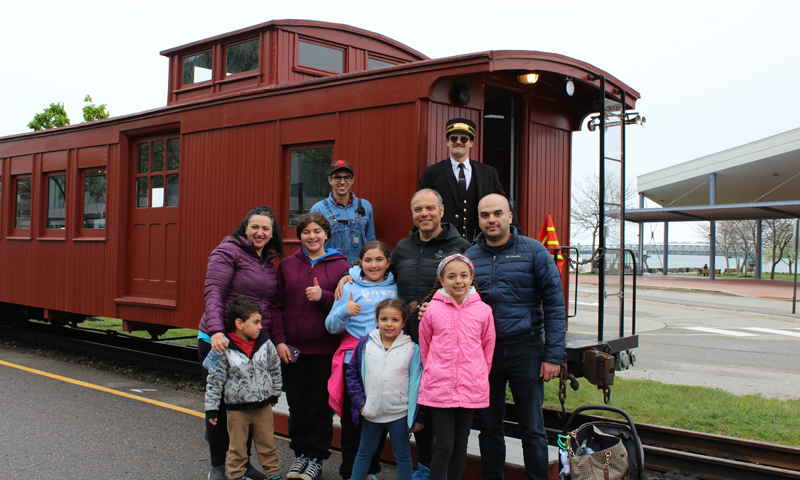 Group in front of red Maine Narrow Gauge train; Photo Credit: Maine Narrow Gauge