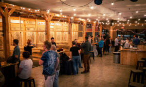 People throwing axes; Photo Credit: Nate Davis