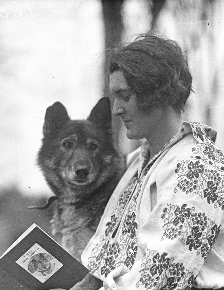 Heroic Dogs in Maine: - Photo Credit: Elizabeth Ricker reading to Togo, Poland Spring, 1928, Collections of Maine Historical Society/MaineToday Media, MaineMemory.Net #116366